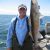 angler holding fish on mille lacs lake