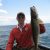 angler holding fish on mille lacs